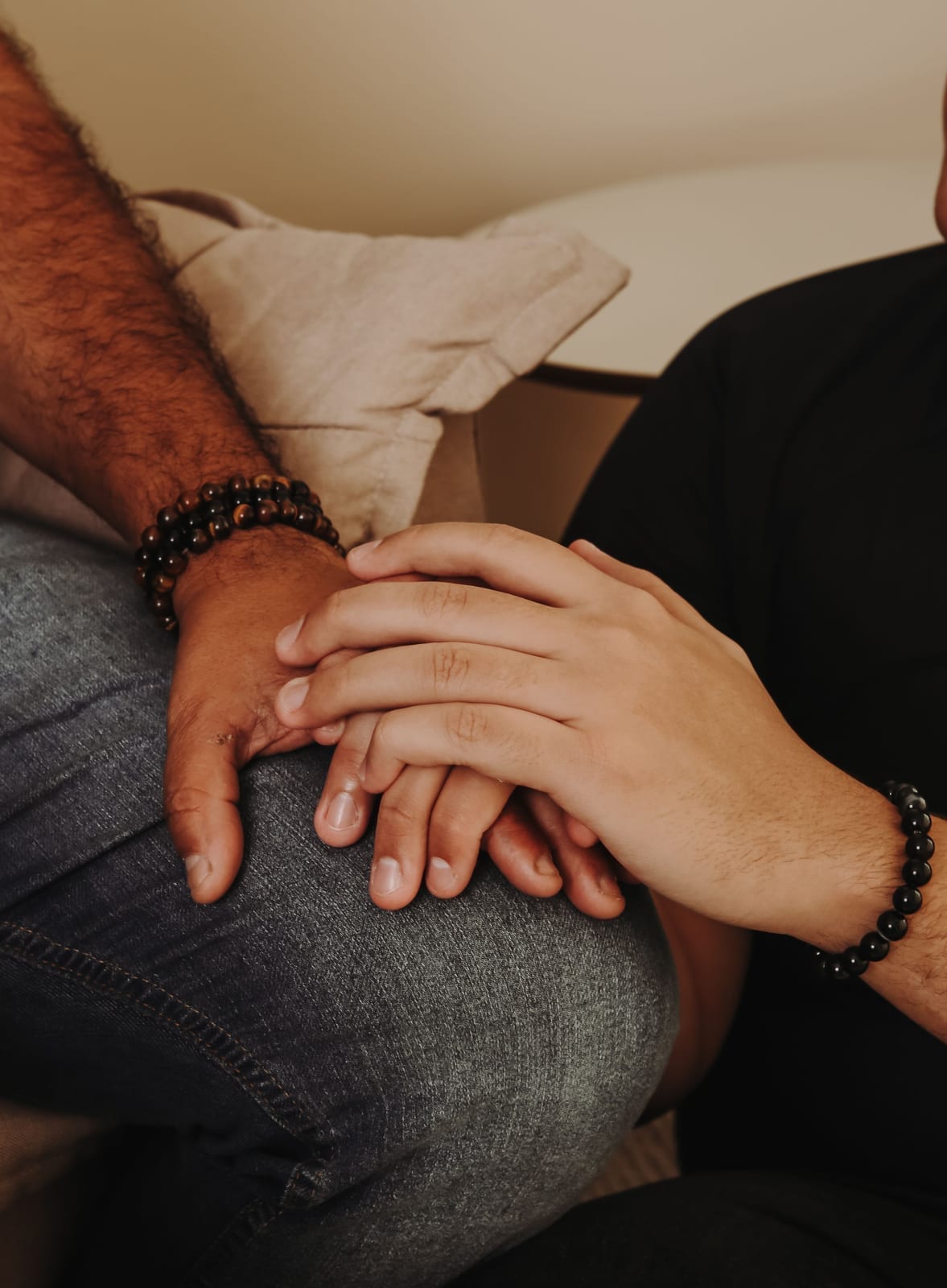 Close-up of two hands holding, symbolizing support and comfort