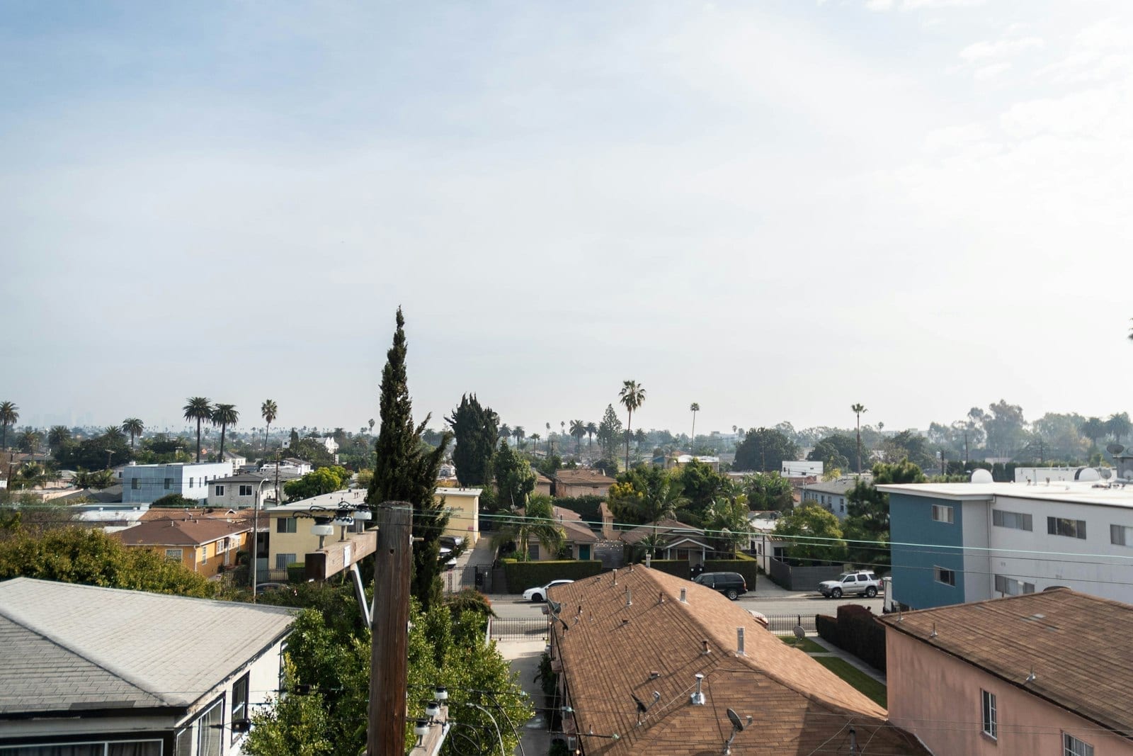 Aerial view of a California suburban neighborhood with houses and palm trees