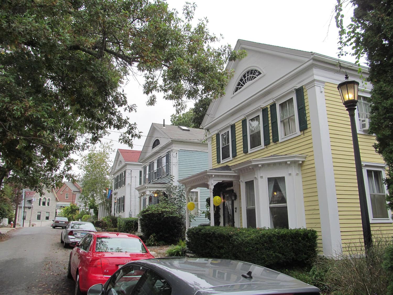 Wood-frame houses set close together along Prospect Street in the Prospect Street Historic District of New London, Connecticut