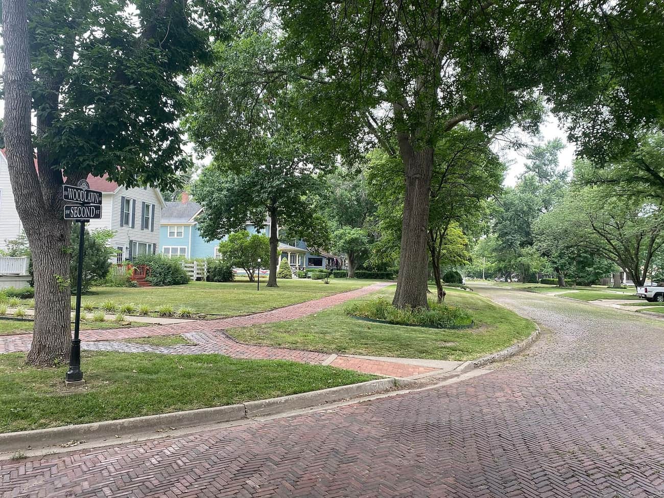 Frame and brick houses at the junction of Second Street and Woodland Avenue in the Potwin Place historic district of Topeka, Kansas