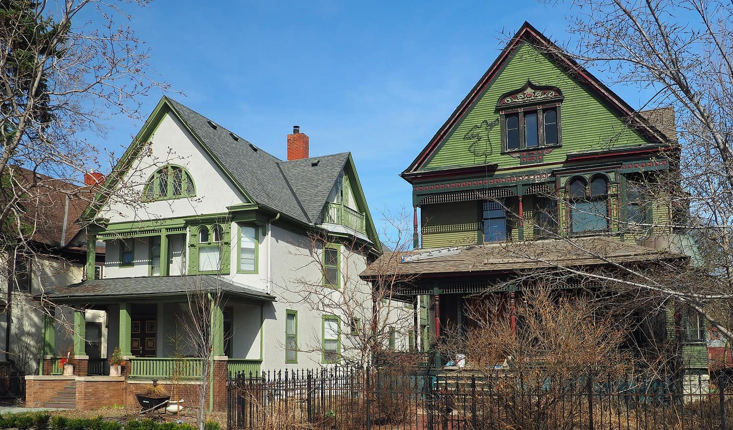 Two restored Victorian houses side by side on 2nd Avenue South in the Healy Block Residential Historic District, Minneapolis