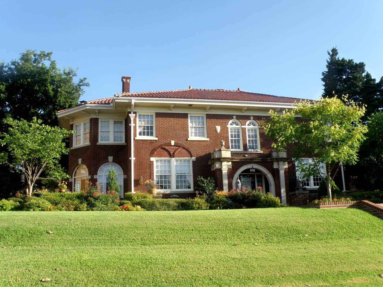 Brick and stucco houses with mature shade trees in the Capitol-Lincoln Terrace Historic District of Oklahoma City