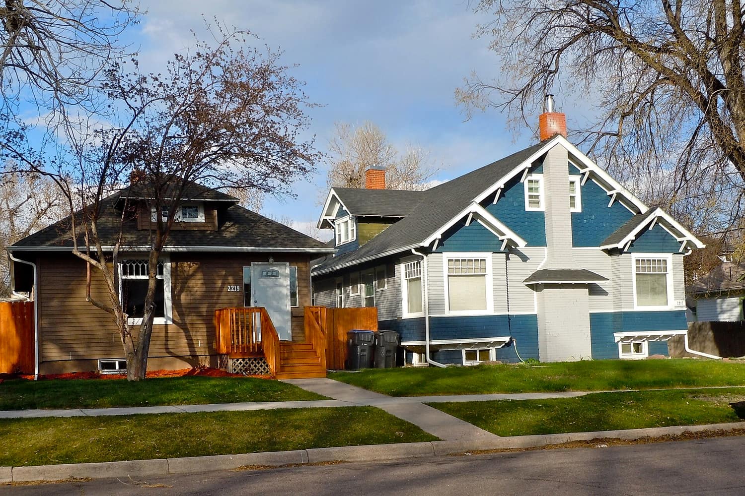 Modest single-family houses with front lawns along a residential street in the Lakeview Historic District of Cheyenne, Wyoming